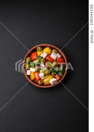 Delicious fresh, juicy Greek salad with feta cheese, olives, tomatoes, cucumber Delicious fresh, juicy Greek salad with feta cheese, olives, tomatoes, cucumber 106049298