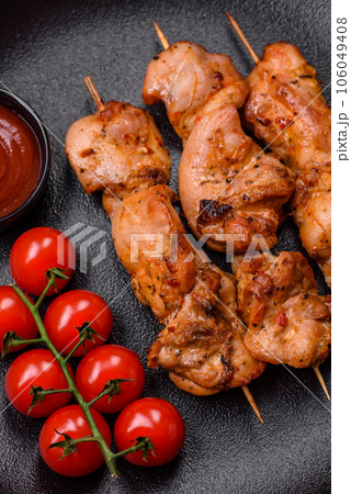 Delicious fresh, juicy chicken or pork kebab on skewers with salt and spices Delicious fresh, juicy chicken or pork kebab on skewers with salt and spices 106049408