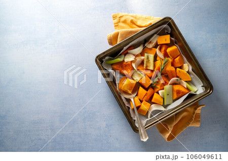 Pumpkin soup. Butternut squash and vegetables ready to be baked in baking tray. Pumpkin soup. Butternut squash and vegetables ready to be baked in baking tray. 106049611