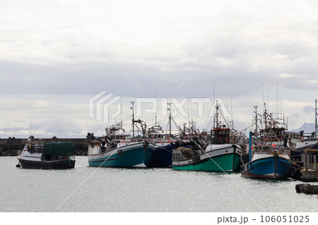 Fishing Trawler Boats Tied Up In Small Harbor Fishing Trawler Boats Tied Up In Small Harbor 106051025