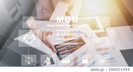 MOU - memorandum of understanding business concept, business Partner handshake nonbinding agreement that states each party's intentions to take action, conduct business transaction, new partnership. 106051454