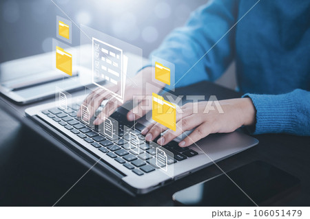 Online documentation database and document management system concept, Businessman using a tablet or computer, Document Management System and Automation software to archiving and efficiently manage. 106051479