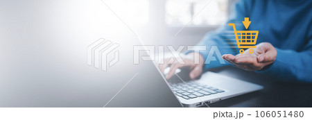 Businessman using a laptop with online shopping concept, marketplace website with virtual interface of online Shopping cart part of the network, Online shopping business with selecting shopping cart. Businessman using a laptop with online shopping concept, marketplace website with virtual interface of online Shopping cart part of the network, Online shopping business with selecting shopping cart. 106051480