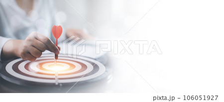 New Targeting with marketing business concept, Businessman hand holding red dart to the virtual target dartboard, Executive marketing, investment goal and target for business investment concept, 106051927