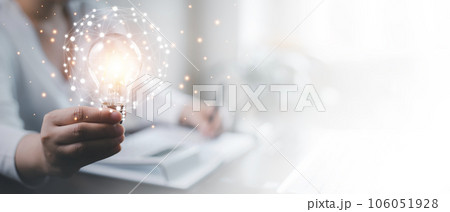 thinking and creative concept, Close up the light bulb and woman working on the desk, Creativity, and innovation are keys to success,  new idea and innovation with Brain and light bulbs,big data 106051928