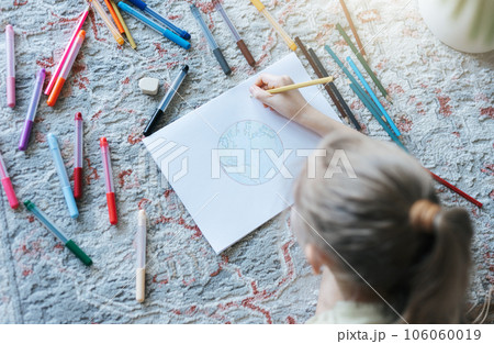 Child girl drawing with colorful pencils Child girl drawing with colorful pencils 106060019