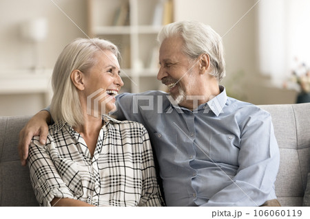 Happy loving senior retired husband and wife hugging with warmth 106060119