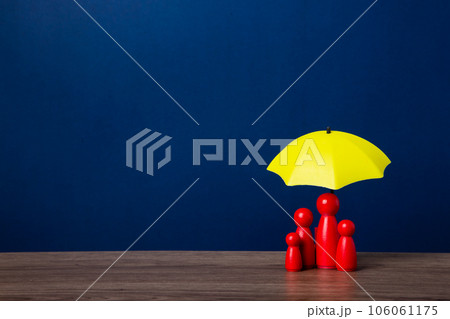 Umbrella and wooden doll figures. 106061175