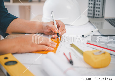 engineer working in office with blueprints, inspection in workplace for architectural plan, construction project ,Business construction engineer working in office with blueprints, inspection in workplace for architectural plan, construction project ,Business construction 106061653