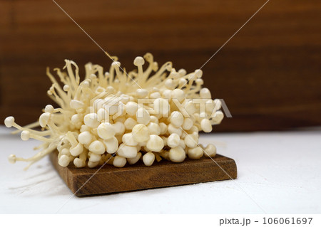 Enoki mushroom close up macro, Golden needle mushroom, used i food and salads. 106061697