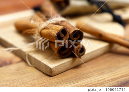 Cinnamon sticks on wooden background close-up, macro. Selective focus Cinnamon sticks on wooden background close-up, macro. Selective focus 106061753