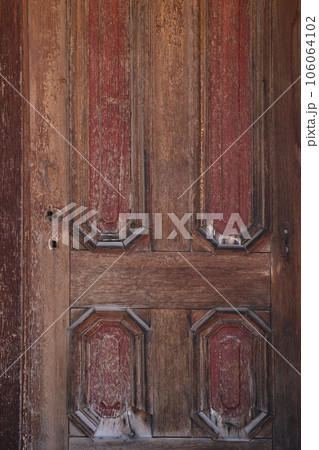 An old wooden entrance door without a lock. An old wooden entrance door without a lock. 106064102