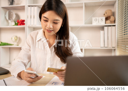 Women use smart phone to register online purchases using credit card payments, Technology for the use of smartphones for business or online financial transactions, Shopping online concept. 106064556