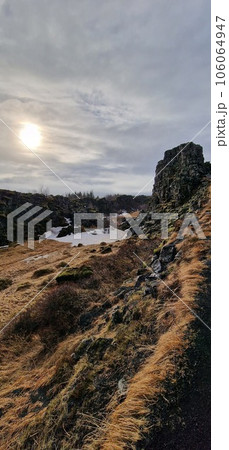 Massive mountain range and valley in arctic setting, Icelandic rocky and snowy peaks in majestic Thingvellir national park. Cliffs and hills in highlands with rock formations, scenic route. 106064947