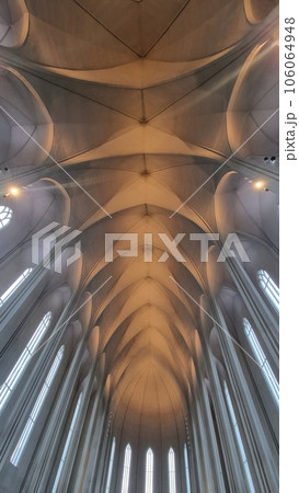 Interior of hallgrimur church with majestic ceiling and huge windows, beautiful decorations and holy sacred design in iceland. Church of hallgrimskirkja decorated as lutheran monument. Interior of hallgrimur church with majestic ceiling and huge windows, beautiful decorations and holy sacred design in iceland. Church of hallgrimskirkja decorated as lutheran monument. 106064948