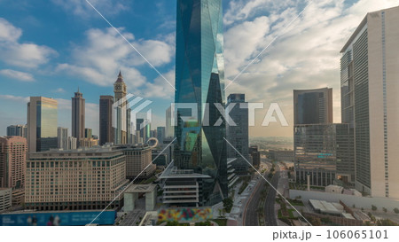Dubai International Financial district aerial night to day timelapse. Panoramic view of business office towers. Dubai International Financial district aerial night to day timelapse. Panoramic view of business office towers. 106065101