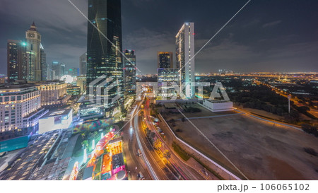 Dubai International Financial district aerial day to night timelapse. Panoramic view of business office towers. 106065102