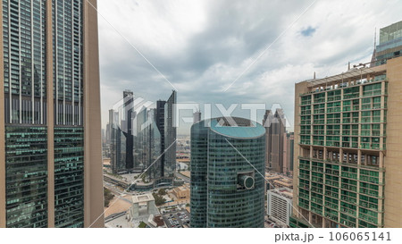Panorama showing Dubai international financial center skyscrapers with promenade on a gate avenue aerial timelapse. 106065141