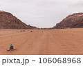 Planet Mars like landscape - Photo of Wadi Rum desert in Jordan with red pink sky above, this location was used as set for many science fiction movies 106068968
