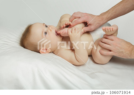 Newborn baby in its father hands at home Newborn baby in its father hands at home 106071914
