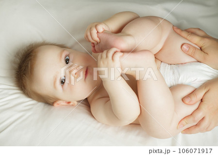 Cute little baby looking at camera, indoor portrait. Beautiful small child, 6 months old Cute little baby looking at camera, indoor portrait. Beautiful small child, 6 months old 106071917