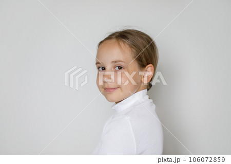 Attractive child girl 10 years old, studio portrait on white 106072859