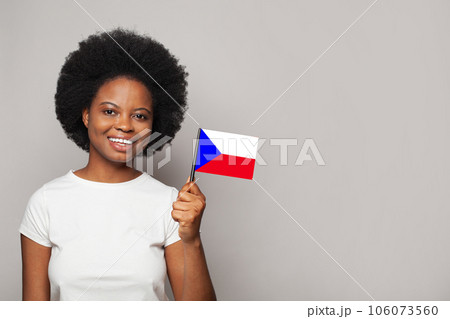 Czech woman holding flag of Czech Republic Education, business, citizenship and patriotism concept Czech woman holding flag of Czech Republic Education, business, citizenship and patriotism concept 106073560