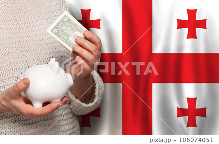 Georgian woman with money bank on the background of Georgia flag. Dotations, pension fund Georgian woman with money bank on the background of Georgia flag. Dotations, pension fund 106074051