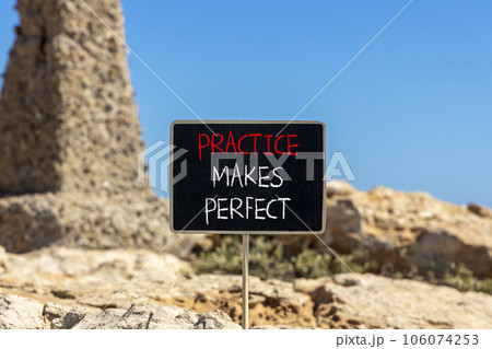 Practice makes perfect symbol. Concept words Practice makes perfect on beautiful black chalk blackboard. Beautiful stone blue sky background. Business practice makes perfect concept. Copy space. Practice makes perfect symbol. Concept words Practice makes perfect on beautiful black chalk blackboard. Beautiful stone blue sky background. Business practice makes perfect concept. Copy space. 106074253