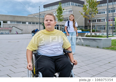 Children go to school, disabled boy 11, 12 years old on a wheelchair close-up Children go to school, disabled boy 11, 12 years old on a wheelchair close-up 106075354