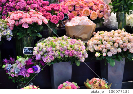 Bouquets of various flowers are displayed in a shop window Bouquets of various flowers are displayed in a shop window 106077183