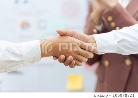 Closeup Handshake of employees after successful planning strategy marketing in the office Closeup Handshake of employees after successful planning strategy marketing in the office 106078521