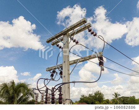 High voltage ceramic insulators on a electricity post. High voltage ceramic insulators on a electricity post. 106082886