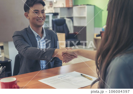 Team Business Partners shaking hands together to Greeting Start up small business in meeting room. Shakehand teamwork partners at modern office handshake together. Business mergers and acquisitions 106084397