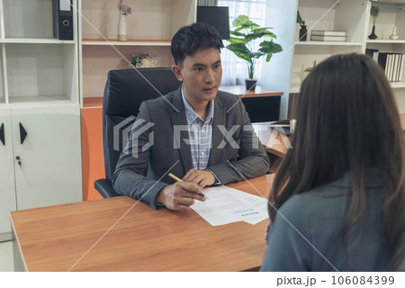 Businessman job interview by human resource HR officer interviwing, talk new employee shaking hands in office with smiling face. HR Manager interview check resume, face to face. Job Interview Concept 106084399