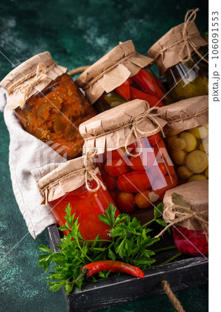 Pickled vegetables in glass jars. Pickled vegetables in glass jars. 106091553