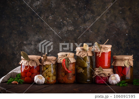 Pickled vegetables in glass jars. Pickled vegetables in glass jars. 106091595