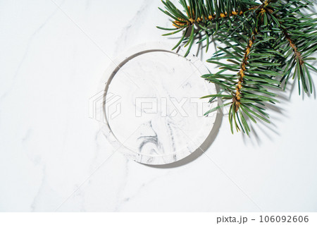 Beauty cosmetics product presentation flat lay mockup soft scene made with circle podium and fir tree branch Beauty cosmetics product presentation flat lay mockup soft scene made with circle podium and fir tree branch 106092606