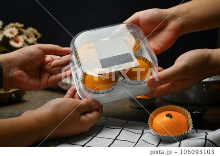 Chinese pastry with stuffed salted yolk on wooden kitchen table. Traditional dessert for Chinese Mid-Autumn festival. Chinese pastry with stuffed salted yolk on wooden kitchen table. Traditional dessert for Chinese Mid-Autumn festival. 106093103
