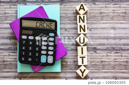 Word ANNUITY on wooden cubes, near calculator and colored notepads on brown background Word ANNUITY on wooden cubes, near calculator and colored notepads on brown background 106093305