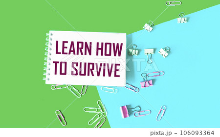 Text on Notepad Learn How to Survive. Survival in times of crisis business concept. Survival during  106093364