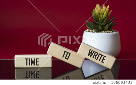 Text Time To Write Lettering Wooden Blocks on red and black background with cactus flower. Business  106093433