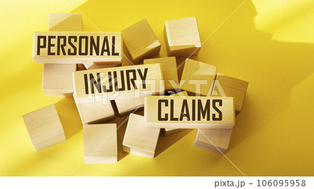 text Personal injury claims written on a wooden block , concept. text Personal injury claims written on a wooden block , concept. 106095958