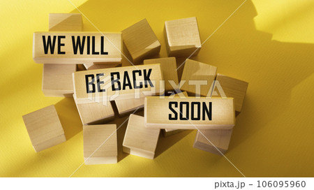 We will be back soon, text on wooden blocks and yellow background We will be back soon, text on wooden blocks and yellow background 106095960
