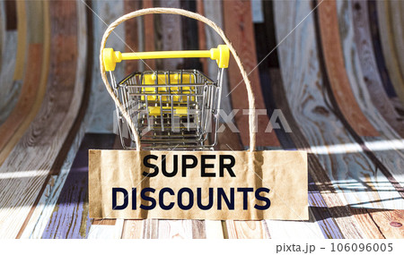 text SUPER DISCOUNTS next to a small cart for goods. Seasonal sale. Black Friday 106096005