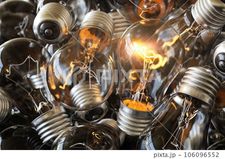 Heap of used old fashioned light bulbs 106096552