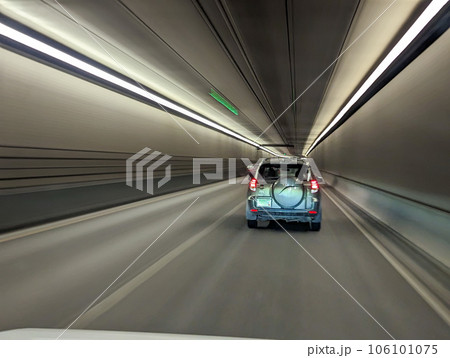 driving through highway tunnel abstract view 106101075