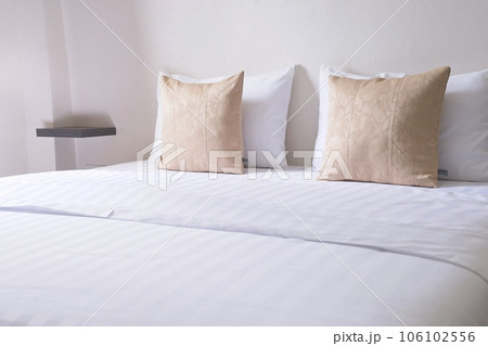 white cozy bedroom, decor idea and design, home interior decoration. light brown pillow side view 106102556