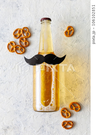 Bottle of beer with moustache. Movember. Concept of father's day, bachelor party. 106102851