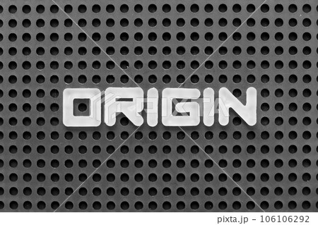 White alphabet letter in word origin on black pegboard background 106106292